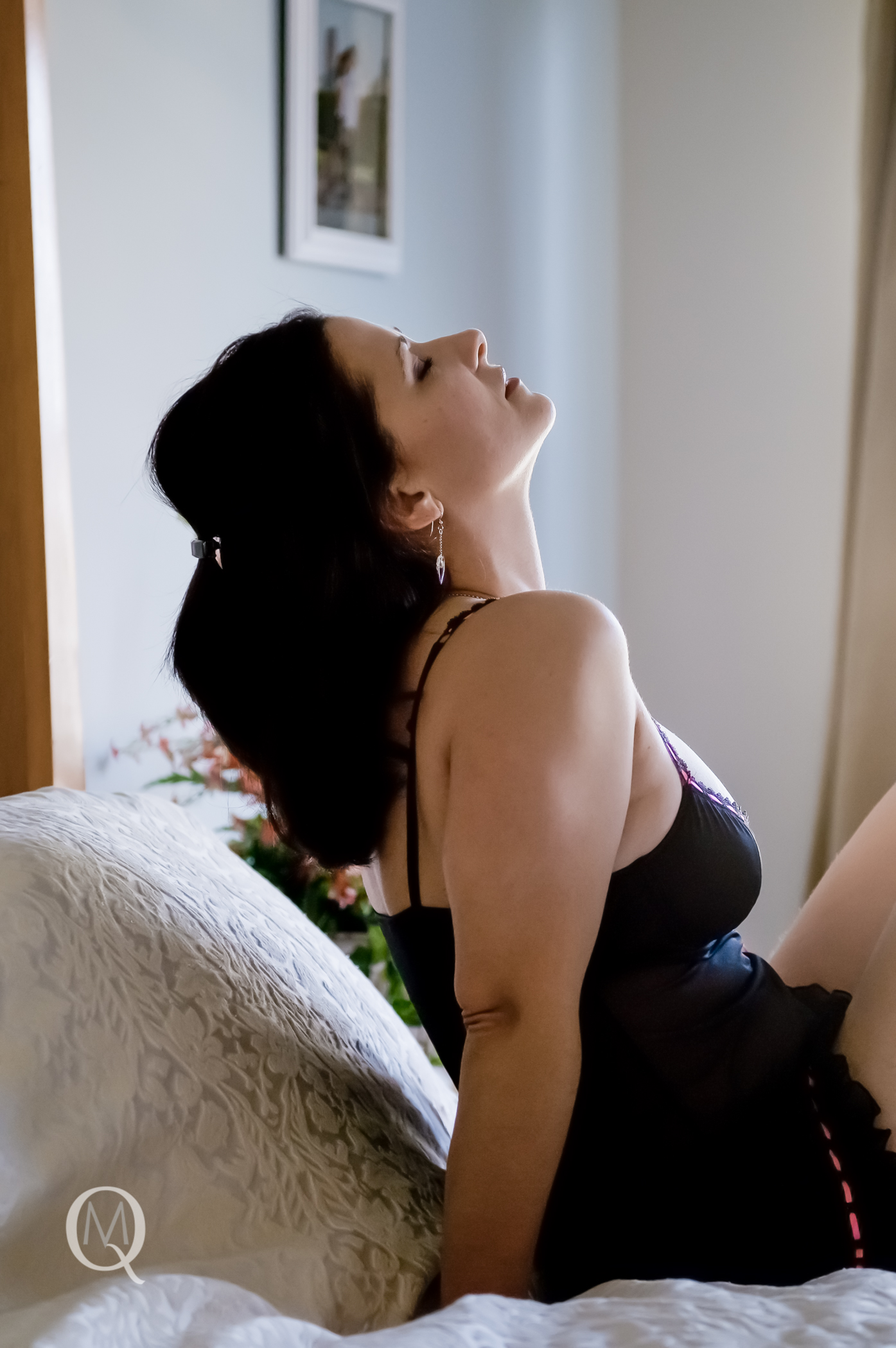 A Boudoir Photo Session of a woman in her bedroom in South Jersey by Mary Quinn Photography Inc.
