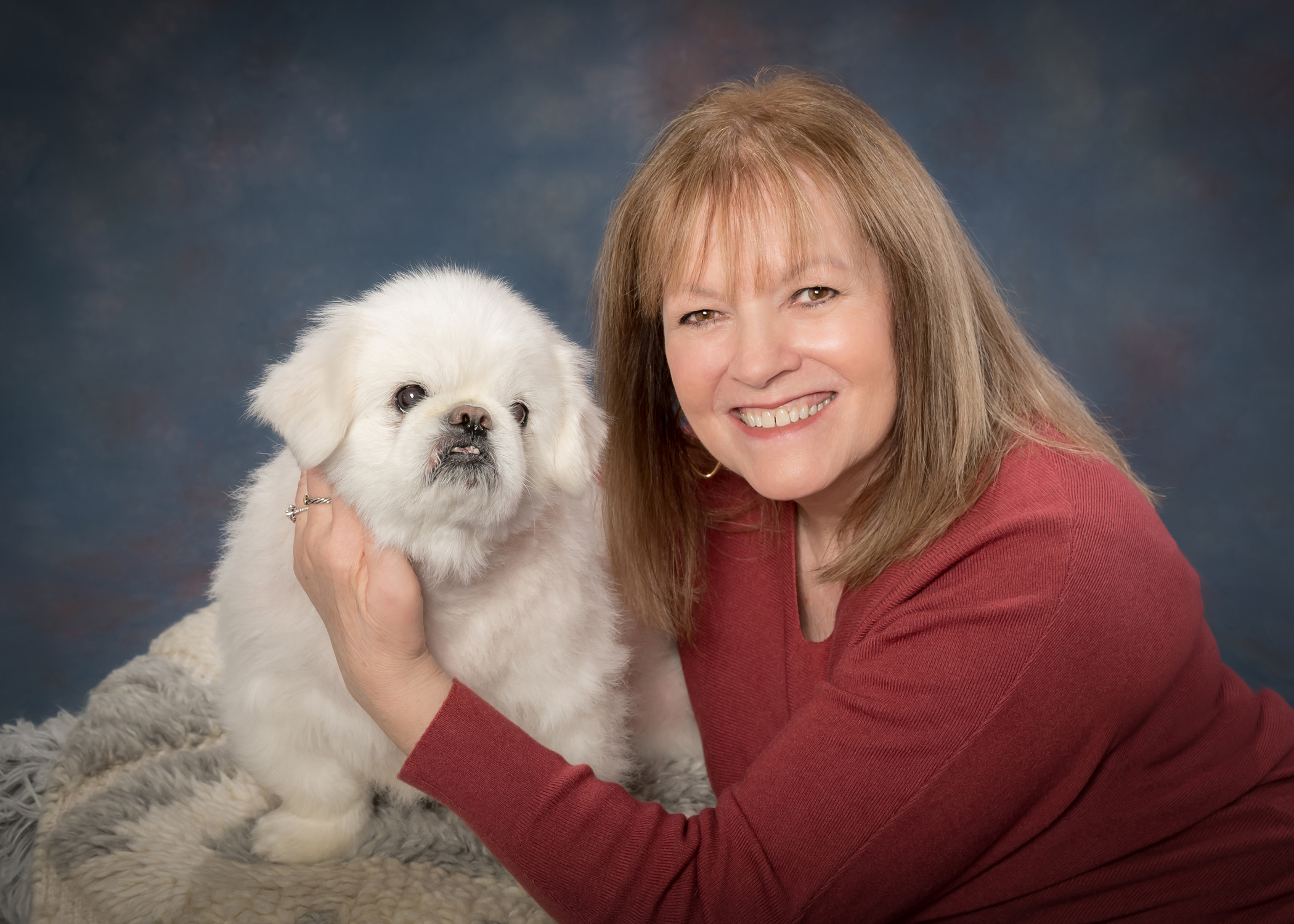 Image of a woman and her little white dog taken by Mary Quinn Photography Inc in Marlton, New Jersey.