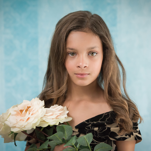Fine Art image of a young girl holding flowers in a South Jersey studio by Mary Quinn Photography, Inc.