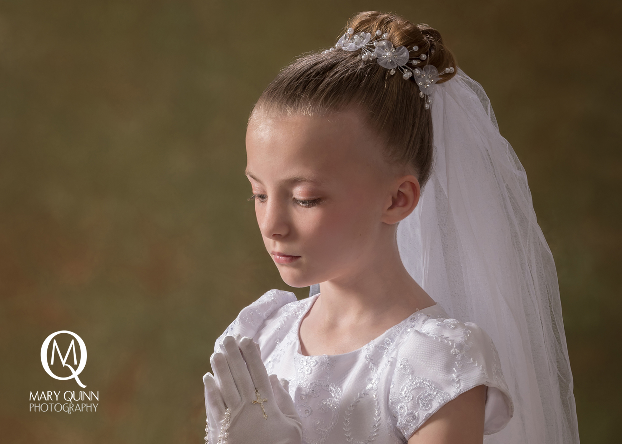 Praying First Communion girl with a Fine Art backdrop in a South Jersey studio.